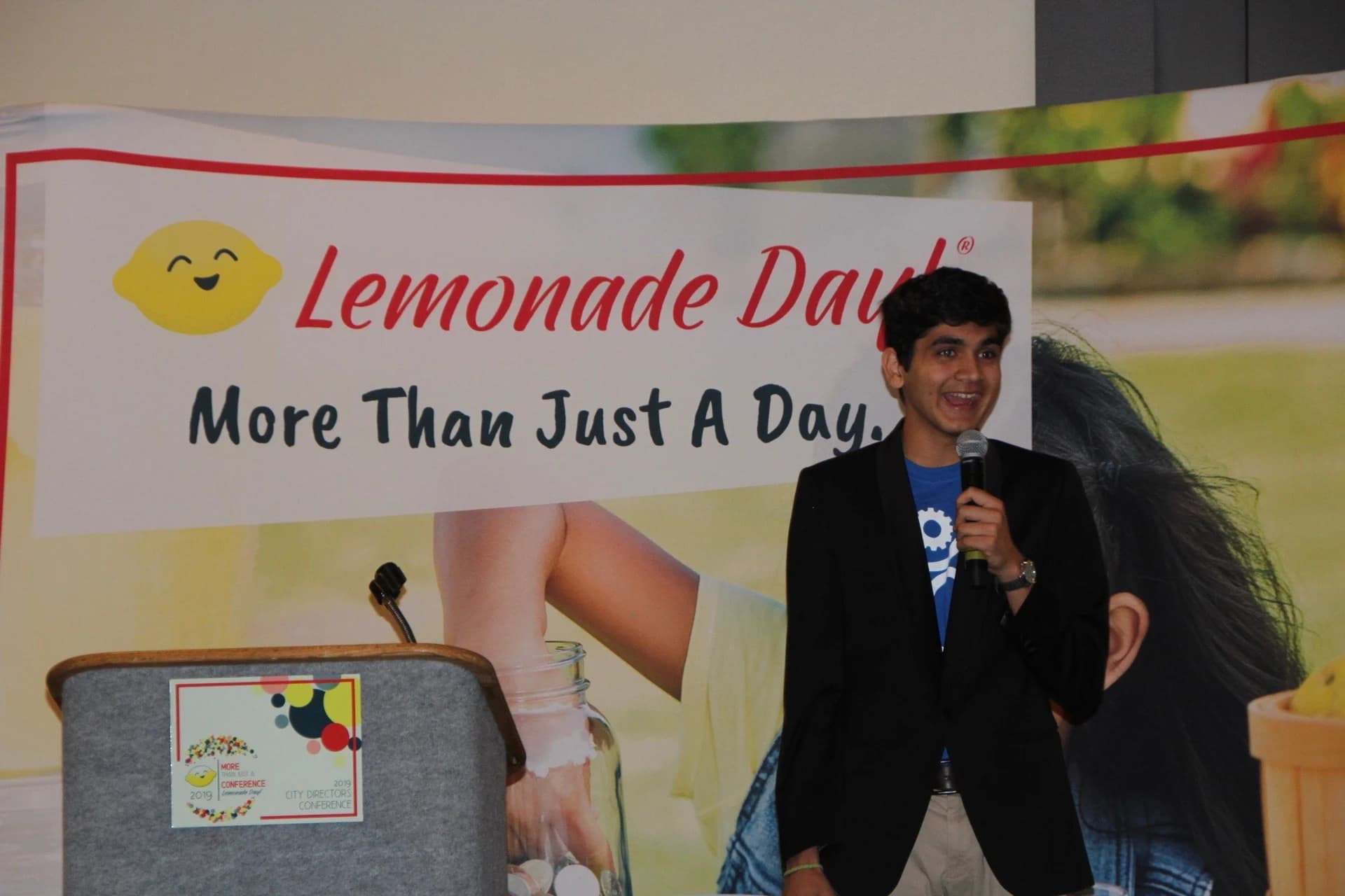 A boy smiling at the podium at the national awards