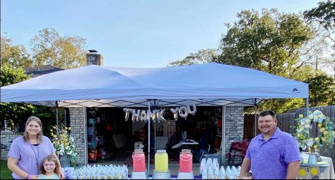 A line of customers at a busy lemonade stand