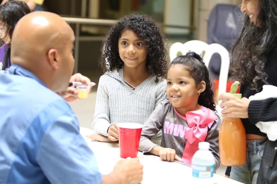 A judge tasting lemonade at the Best Lemonade contest in Puerto Rico