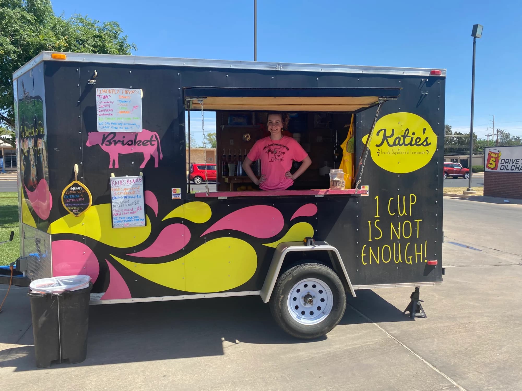 Katie beside her lemonade food trailer