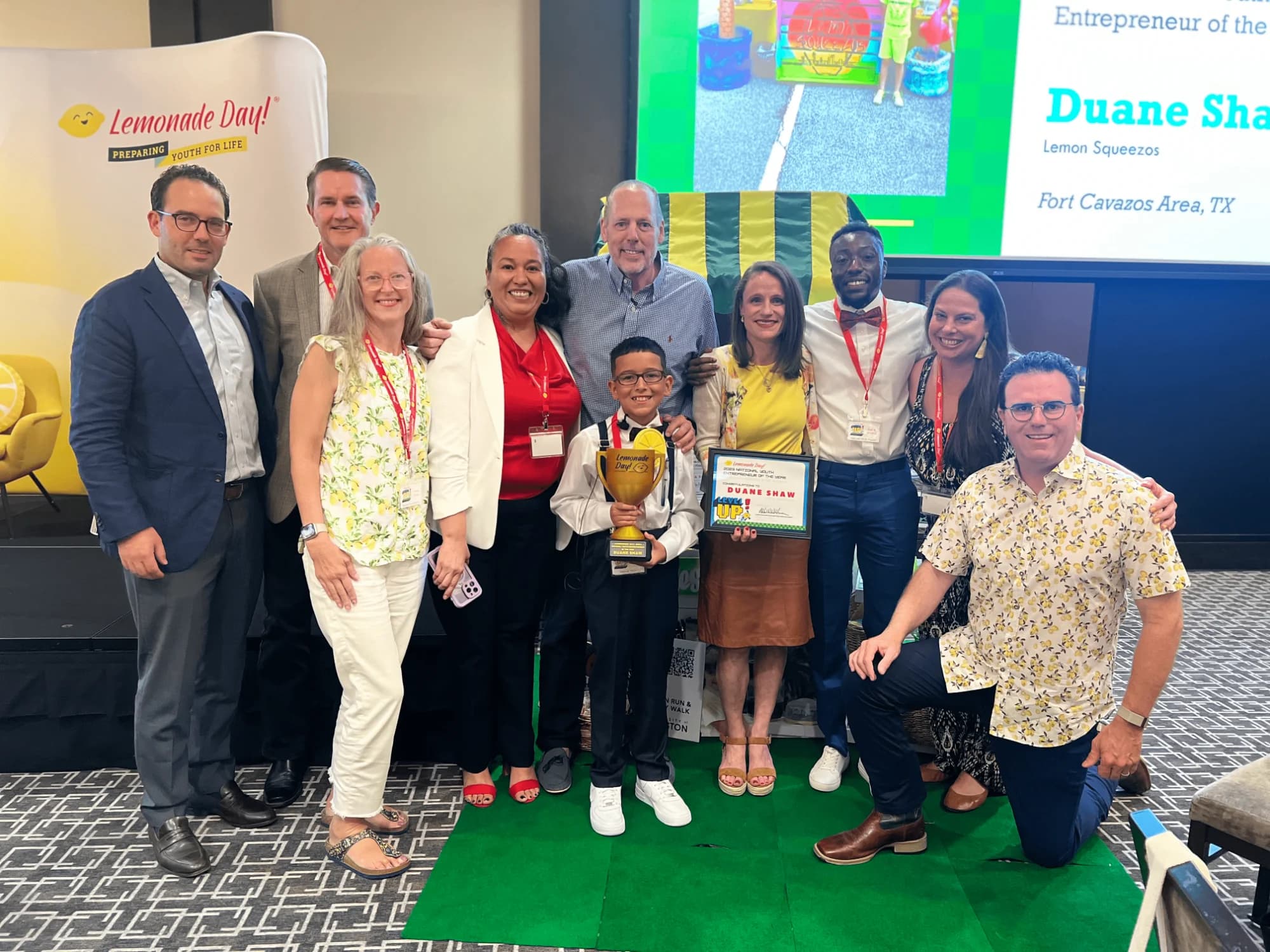 Duane Shaw on stage with the Lemonade Day team as Entrepreneur of the Year
