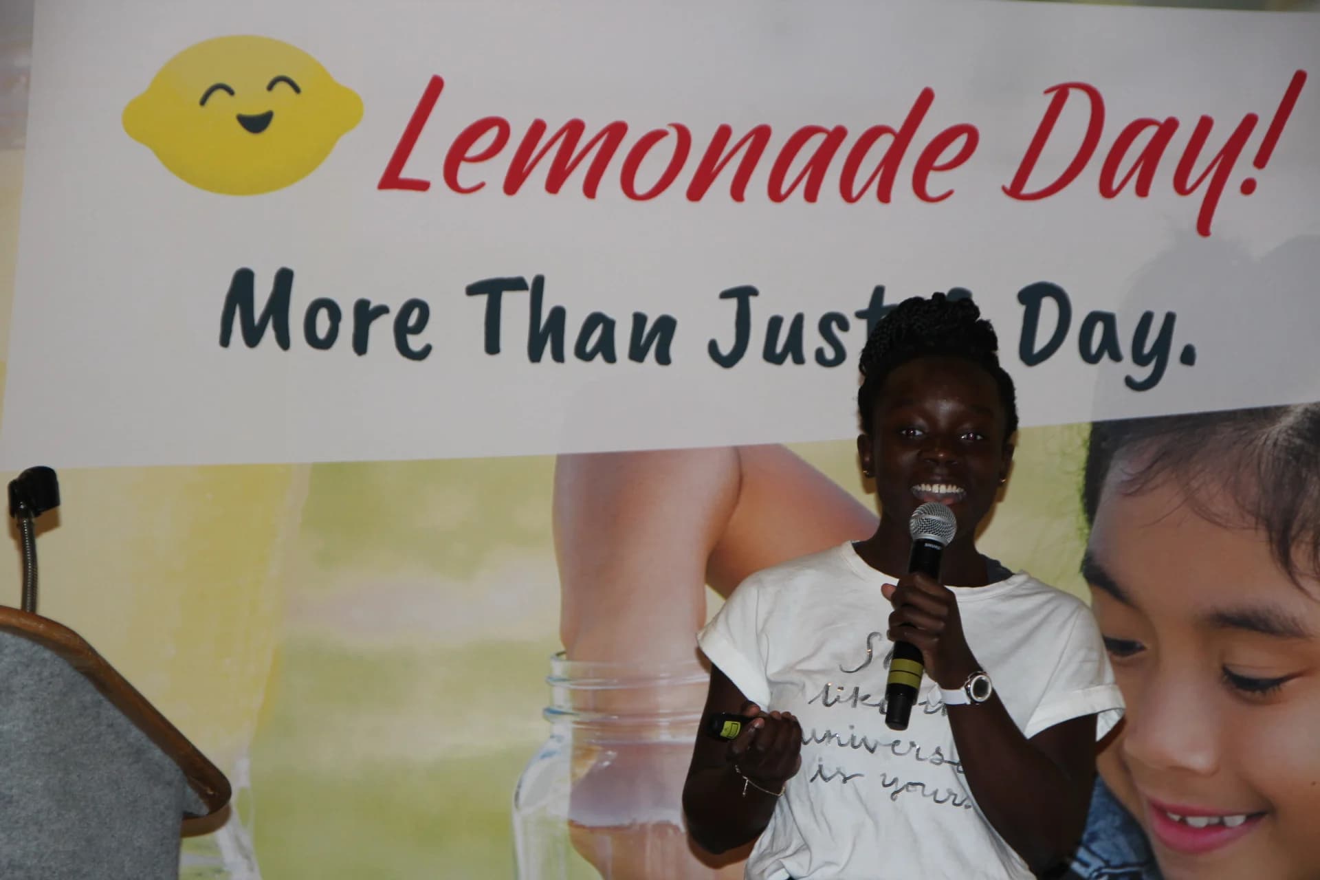 A girl with a microphone accepting her award