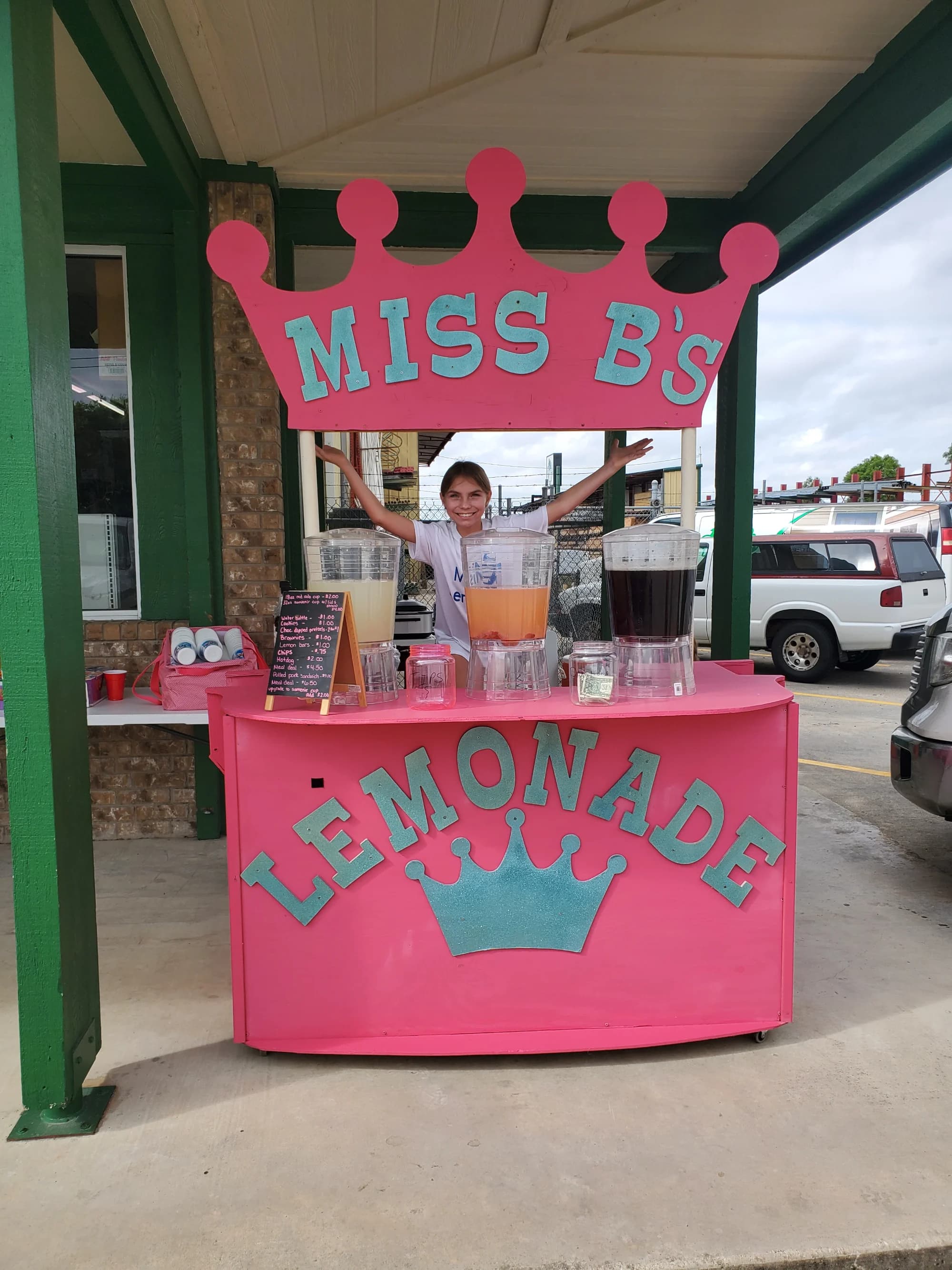 Miss B's pink lemonade stand with a crown on top
